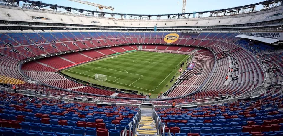 Camp Nou stadium with empty seats and field