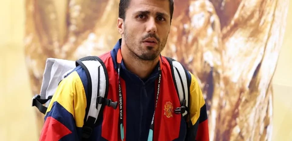 Sporting athlete in team jacket with backpack