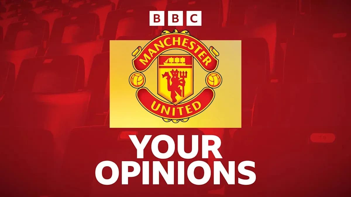 Manchester United logo with audience seating background