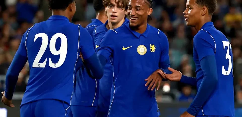 Chelsea players celebrating together on the pitch