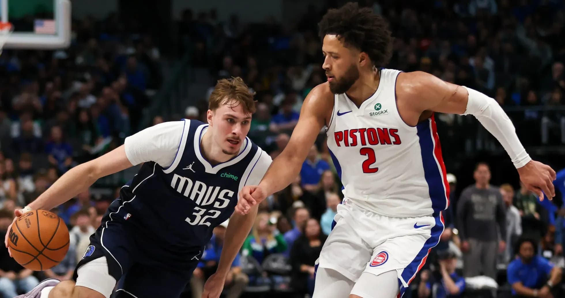 Two basketball players competing for the ball