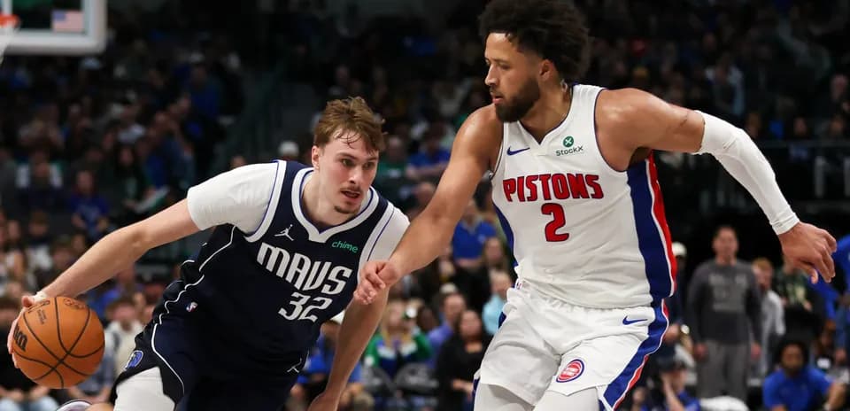 Two basketball players competing for the ball