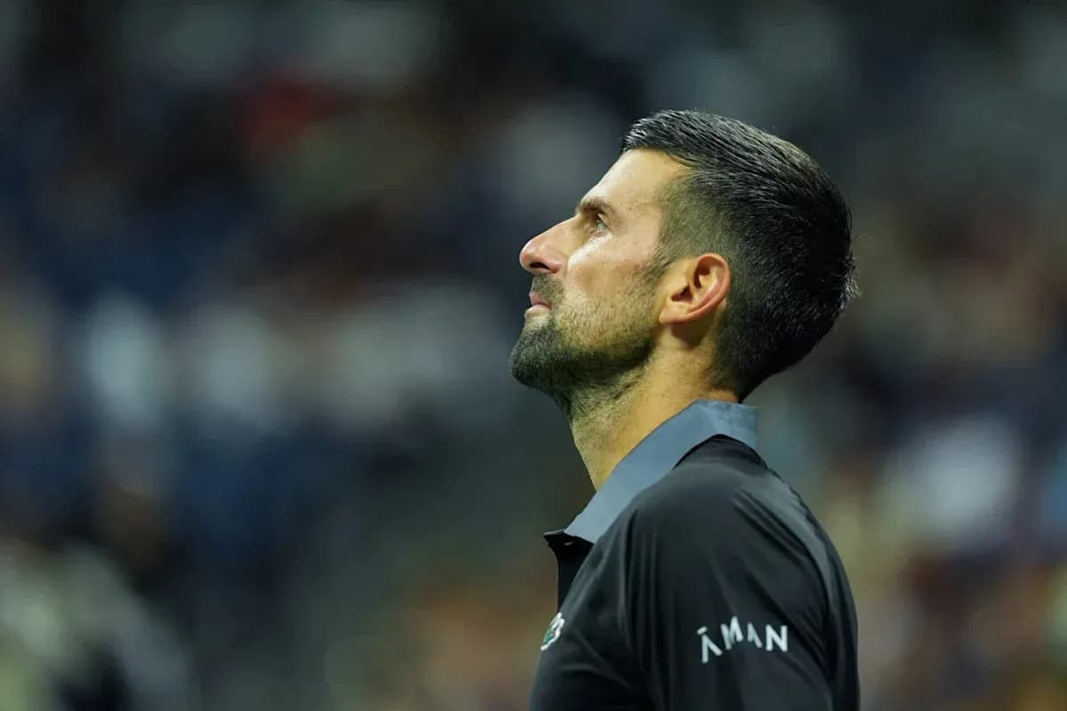 Tennis player looking upwards during match