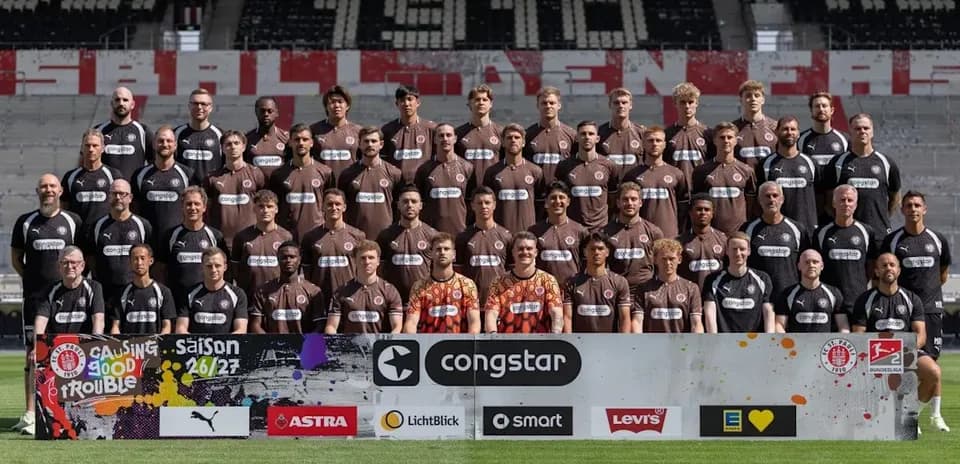 St. Pauli team group photo with sponsors