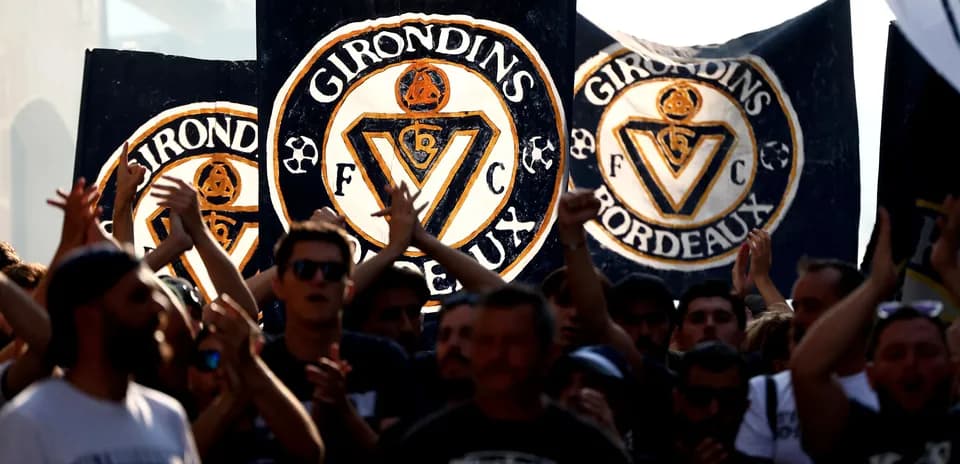 Girondins de Bordeaux fans holding large banners