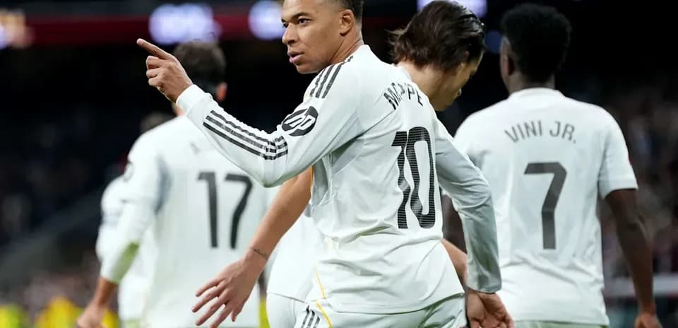 Mbappé celebrating with teammates after scoring