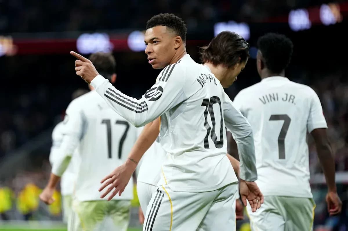 Mbappé celebrating with teammates after scoring