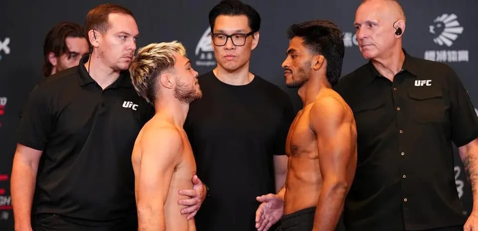 Two fighters facing off at weigh-in event