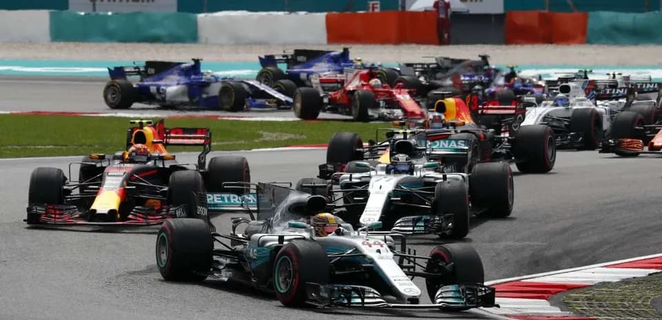 Formula 1 cars racing at a circuit