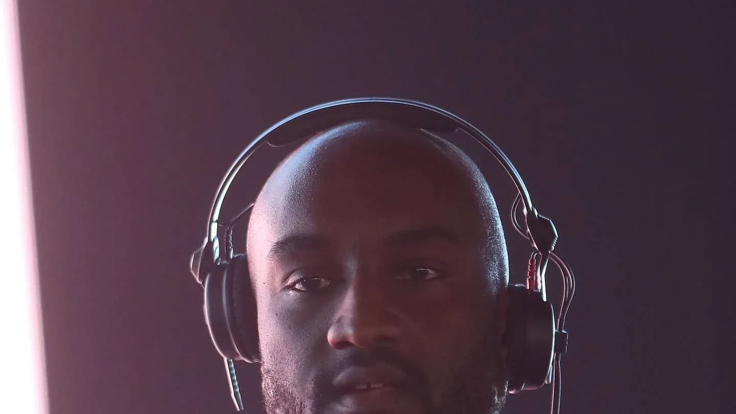 Man wearing headphones in a dimly lit setting