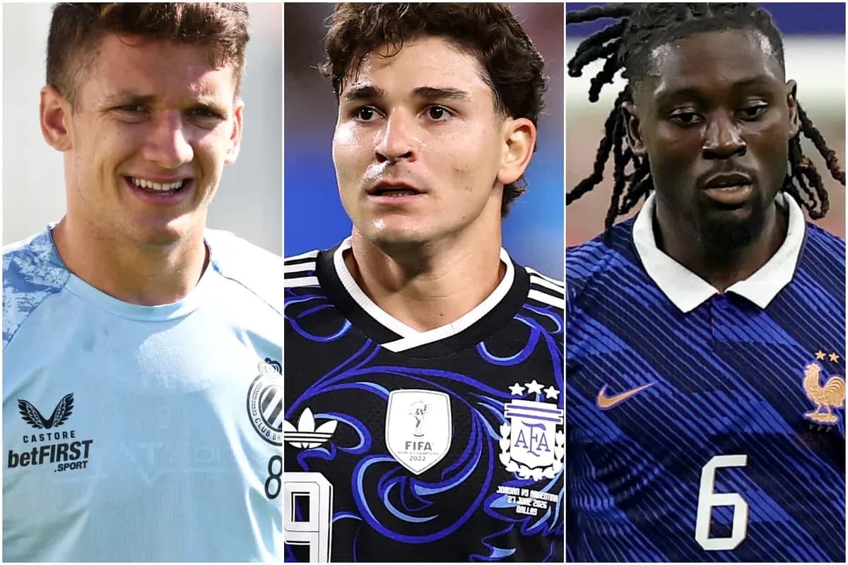 Three football players in team kits during match