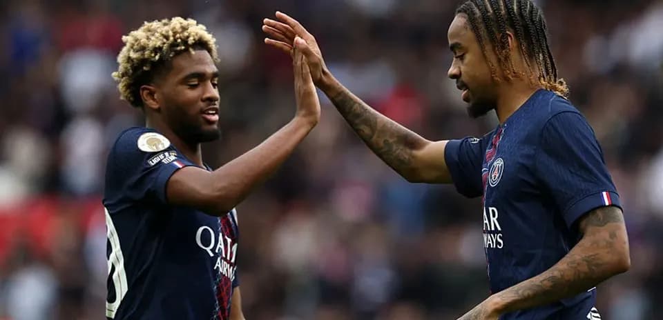 PSG players celebrating with a high five