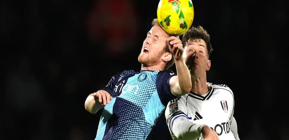 Two players challenging for the ball during match