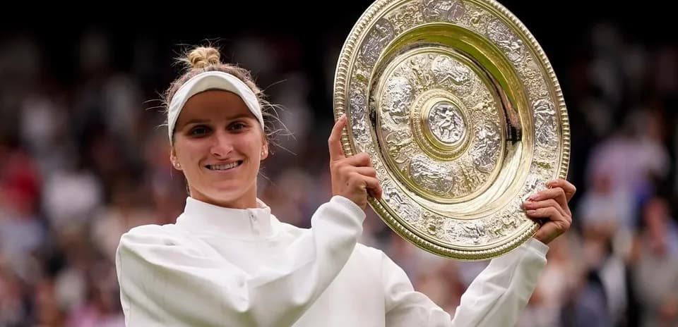 Tennis player celebrating with Wimbledon trophy