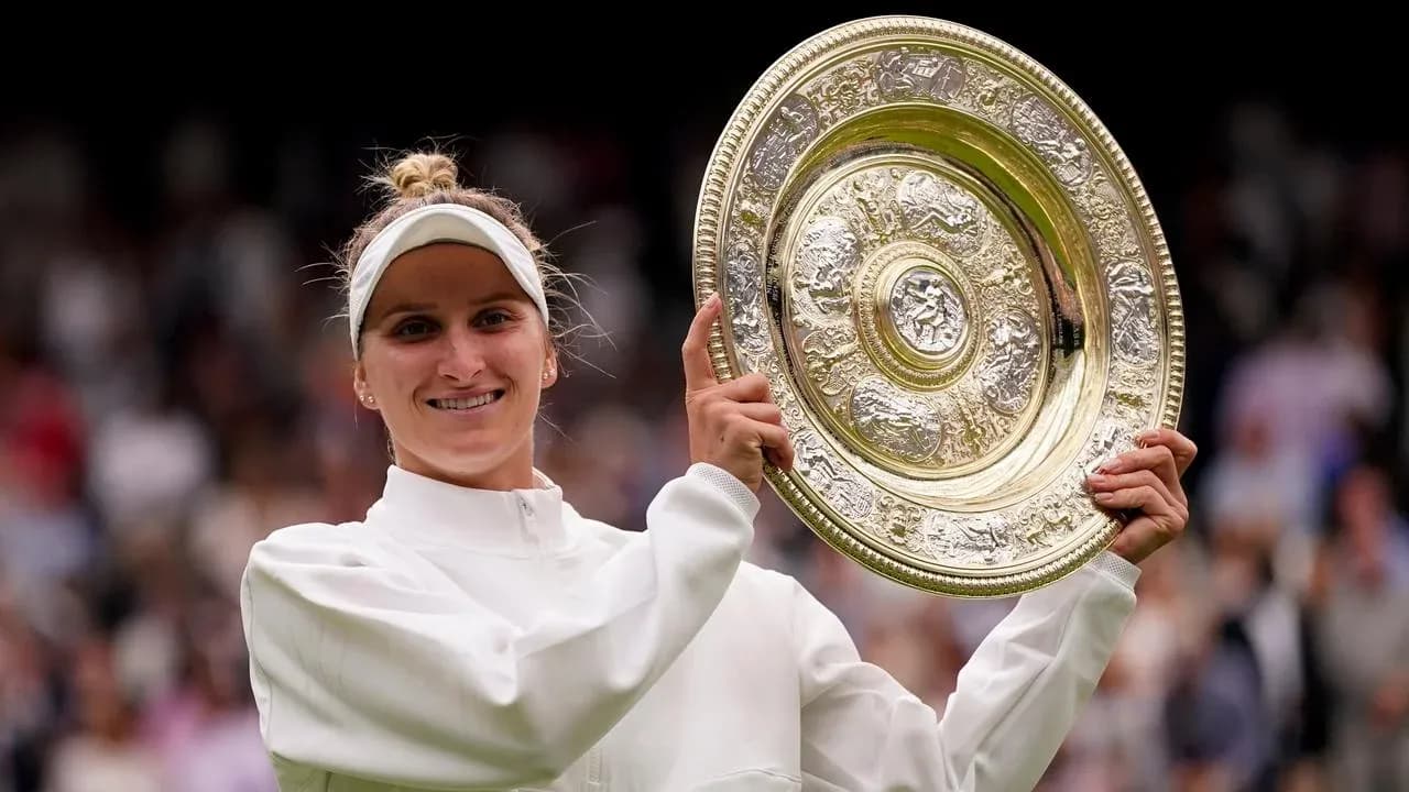 Tennis player celebrating with Wimbledon trophy