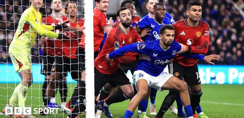 Everton and Manchester United players in penalty area