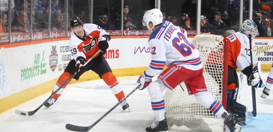 Hockey players battling near the goal during match