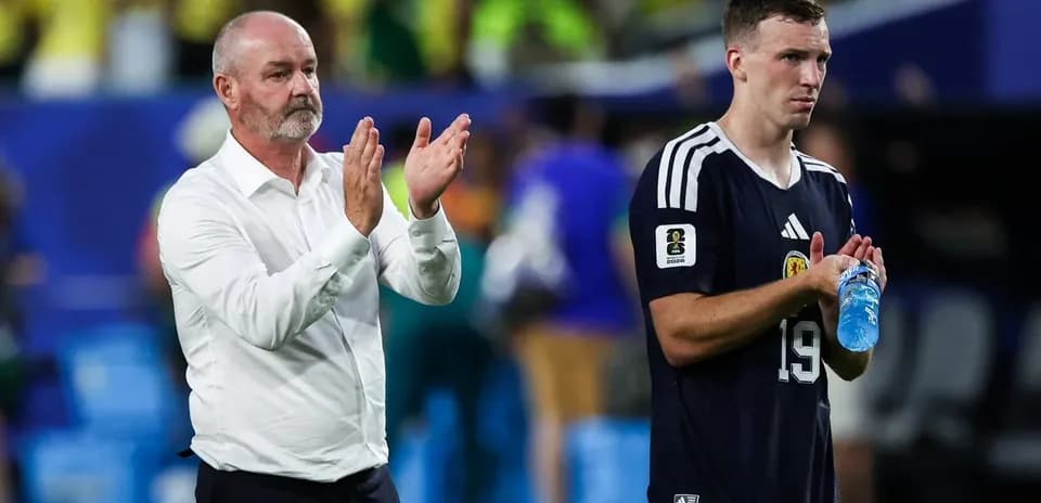 Coach and player applauding after match conclusion