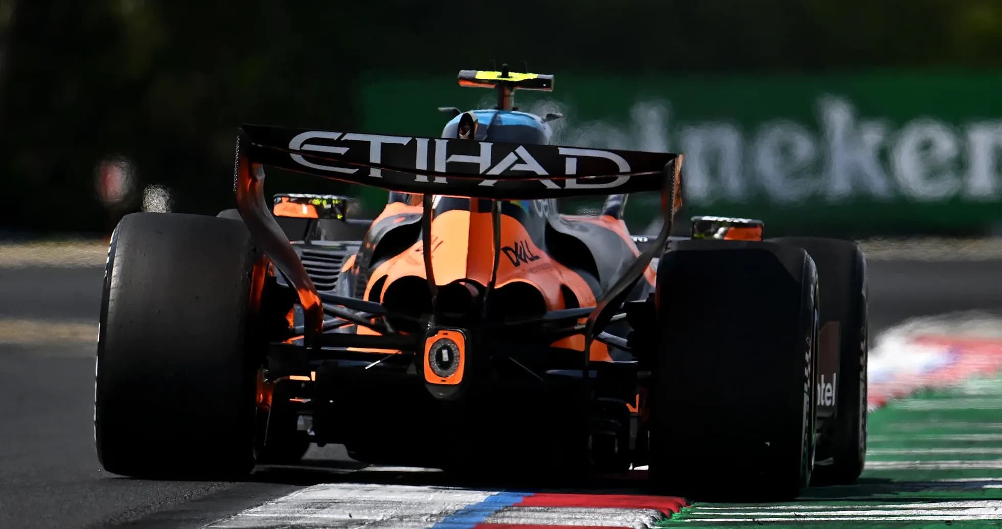 Formula 1 car racing on track with ETIHAD branding