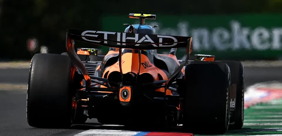 Formula 1 car racing on track with ETIHAD branding