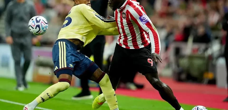 Two players battling for the ball during match
