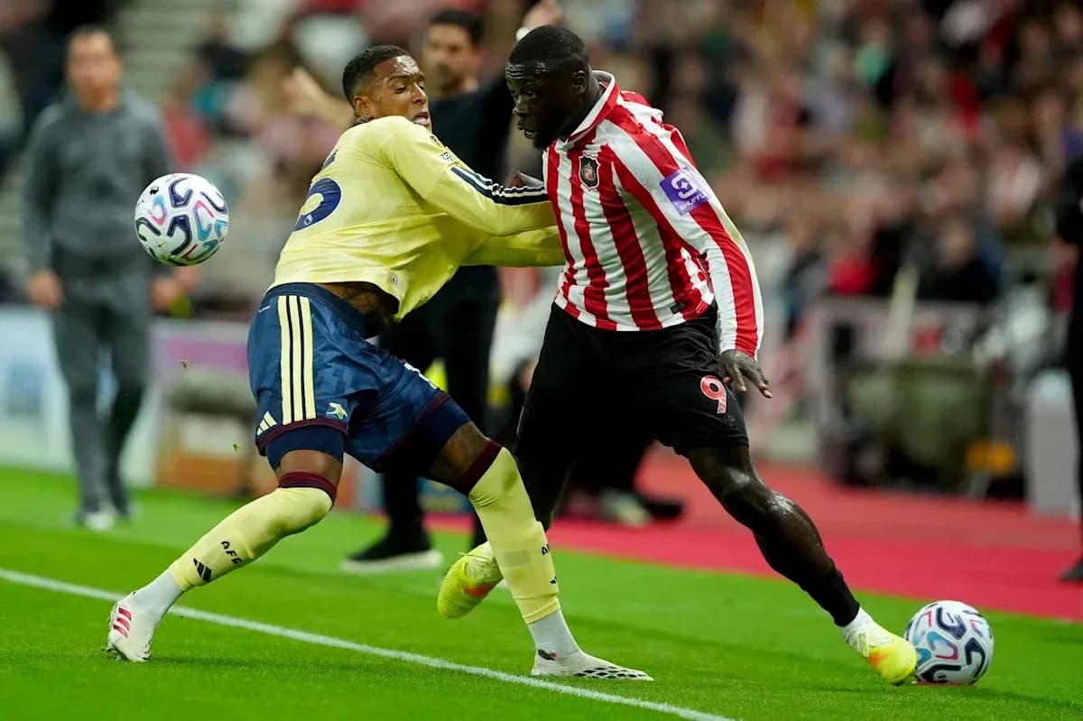 Two players battling for the ball during match