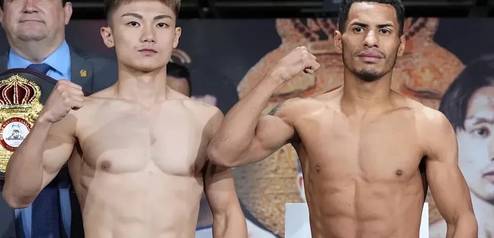 Boxers posing during weigh-in ceremony for match