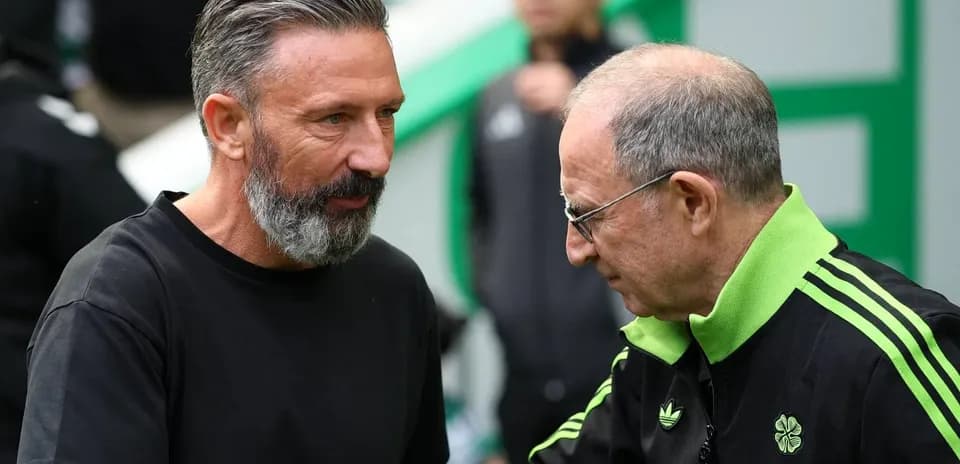 Two coaches speaking before a match