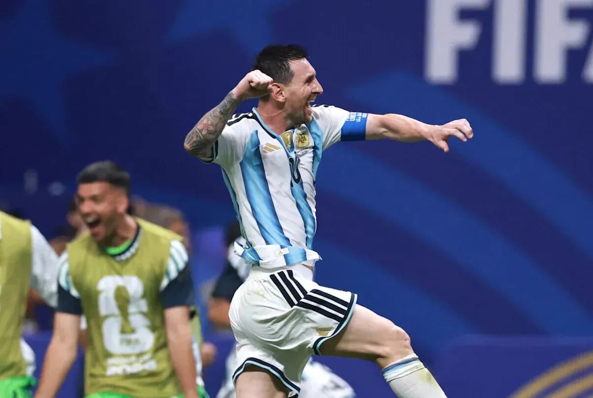 Messi celebrating a goal with teammates in background