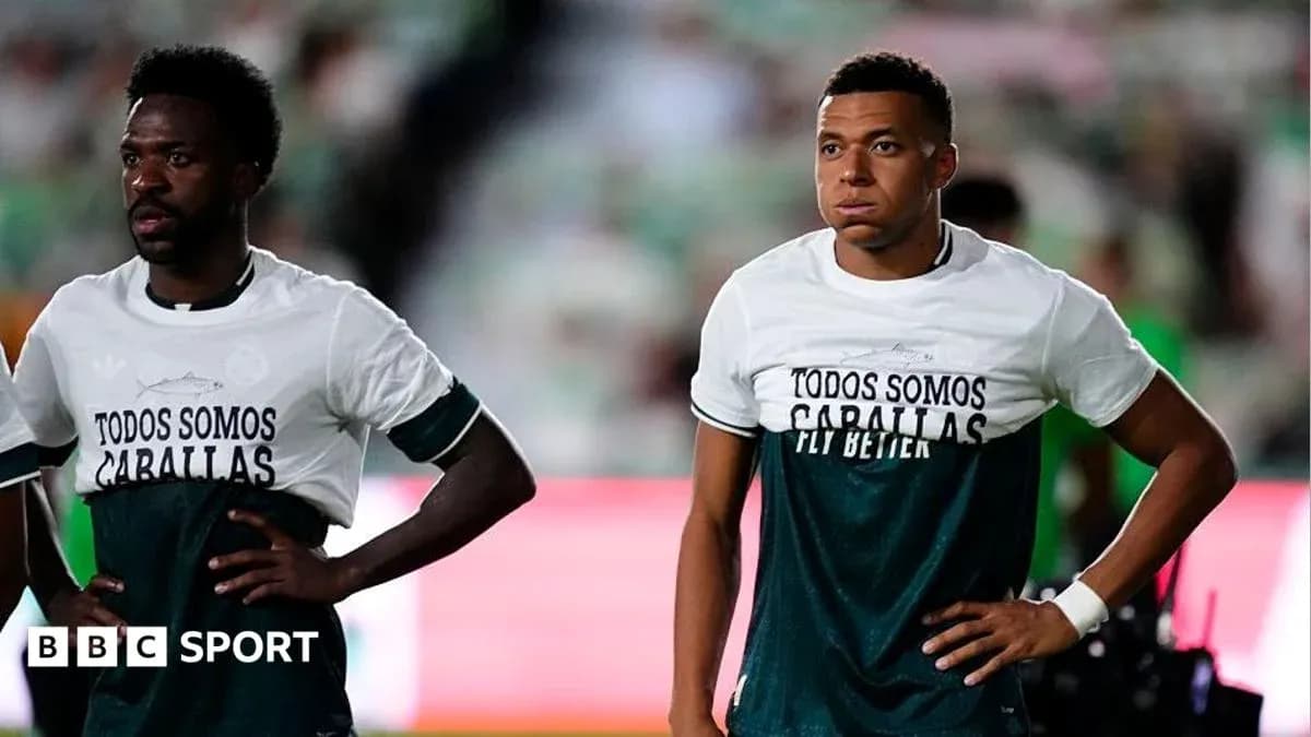 Two players in warm-up shirts before match