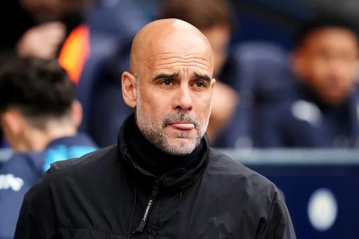 Bald coach observing the match from the sidelines