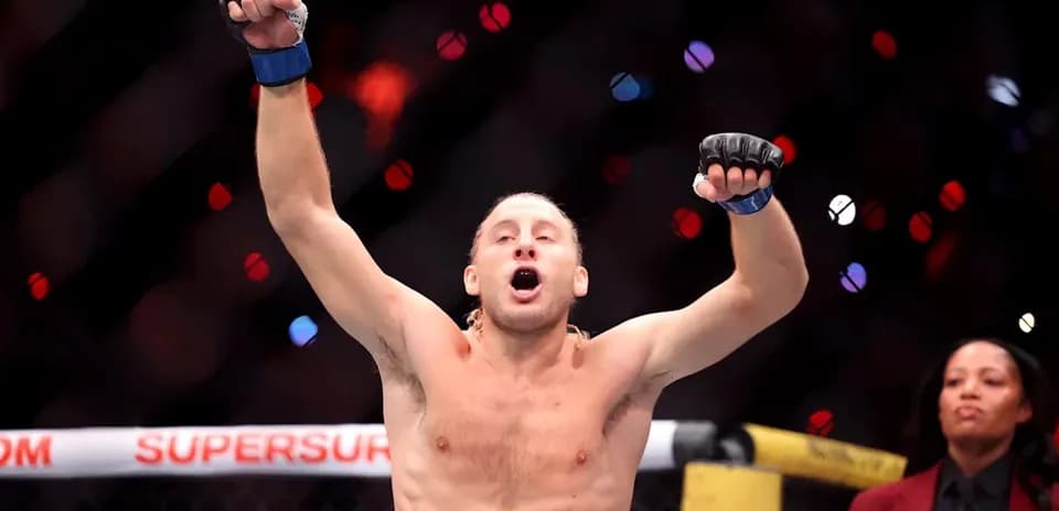 Fighter celebrating victory in the octagon