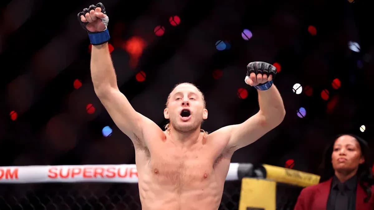 Fighter celebrating victory in the octagon