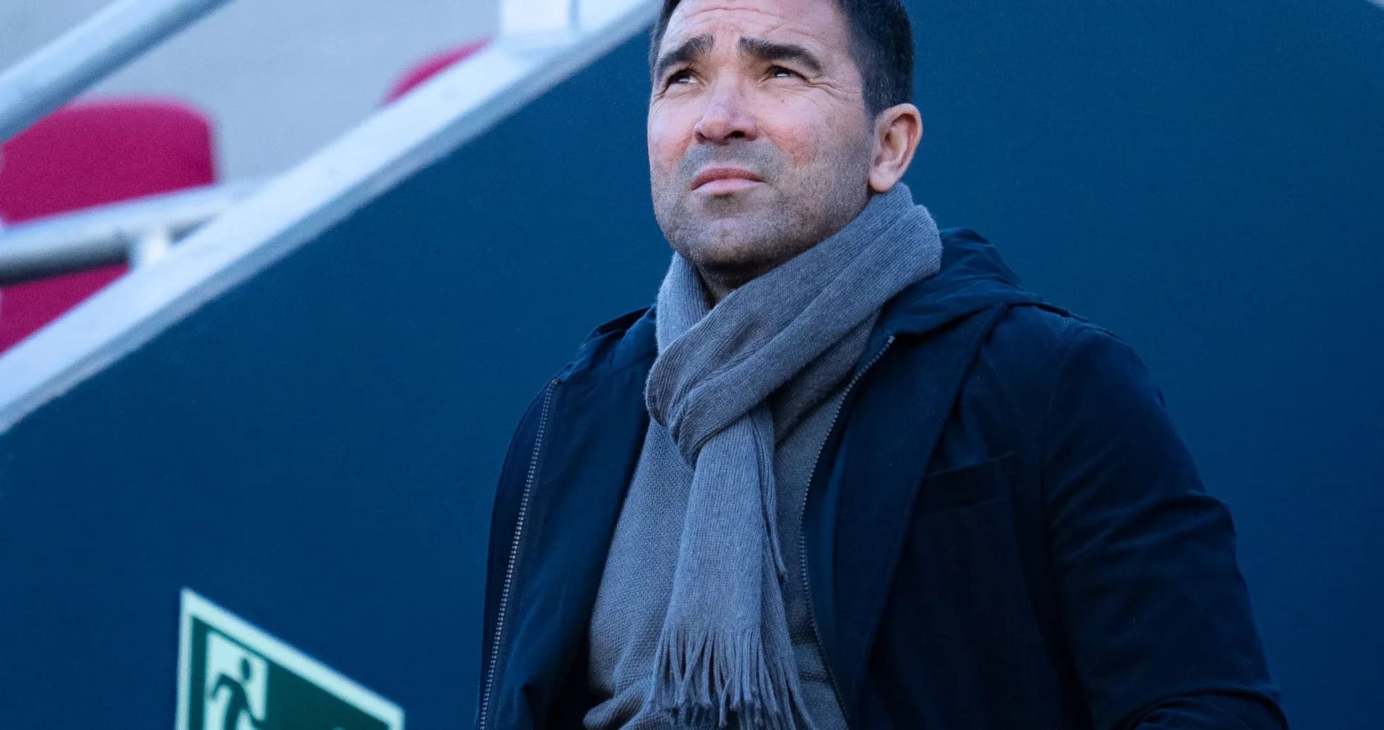 Person looking up, wearing a scarf and jacket