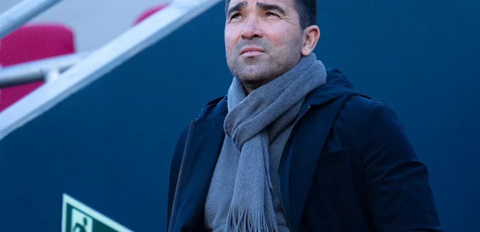 Person looking up, wearing a scarf and jacket