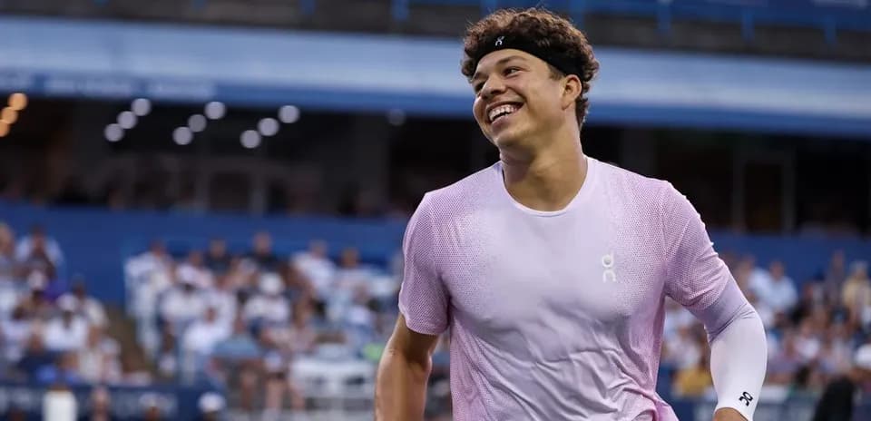 Tennis player smiling during match at stadium