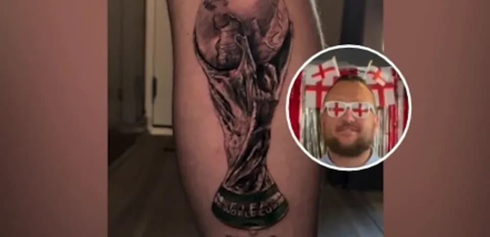 Tattoo of FIFA World Cup trophy on leg