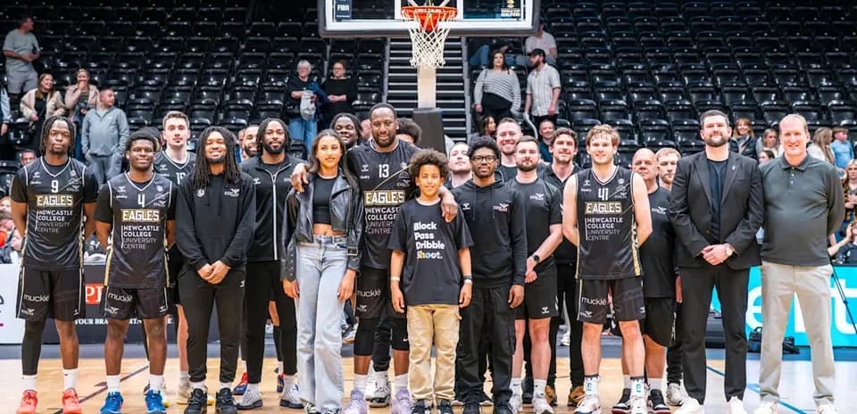 Newcastle Eagles basketball team posing on court