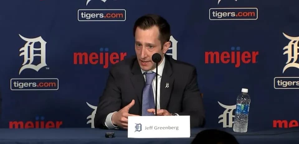 Jeff Greenberg speaking at press conference podium