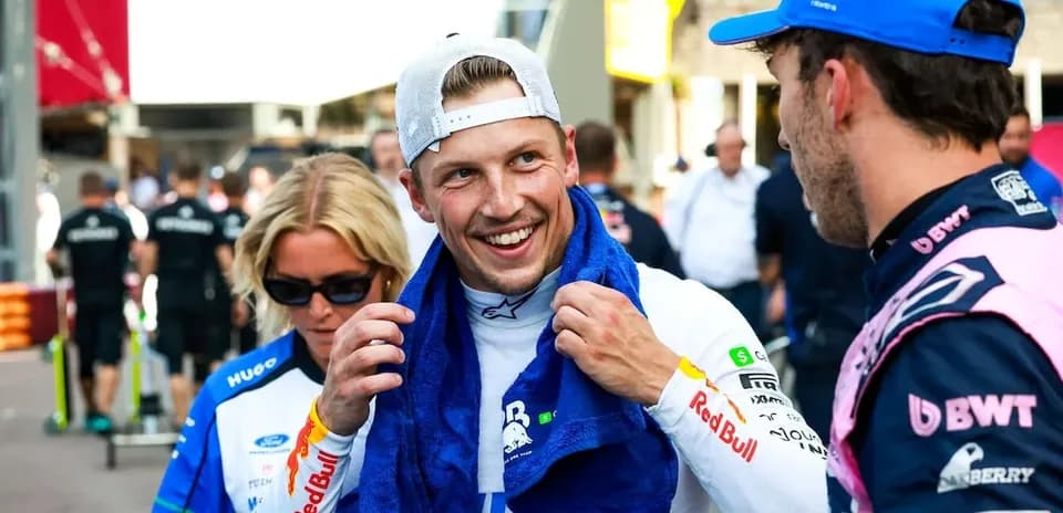 Two drivers chatting in the paddock area