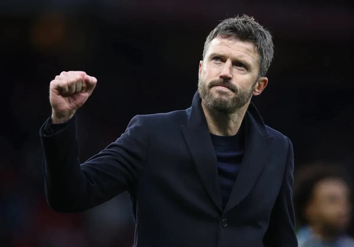 Coach celebrating with fist raised after match