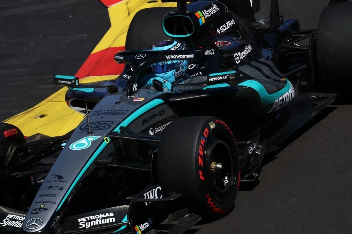 Mercedes F1 car navigating a corner on track