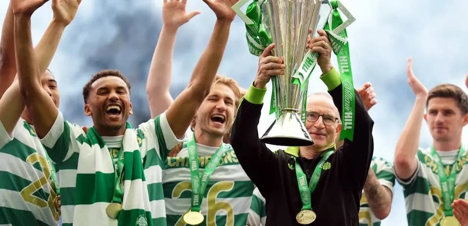 Celtic players celebrating with championship trophy