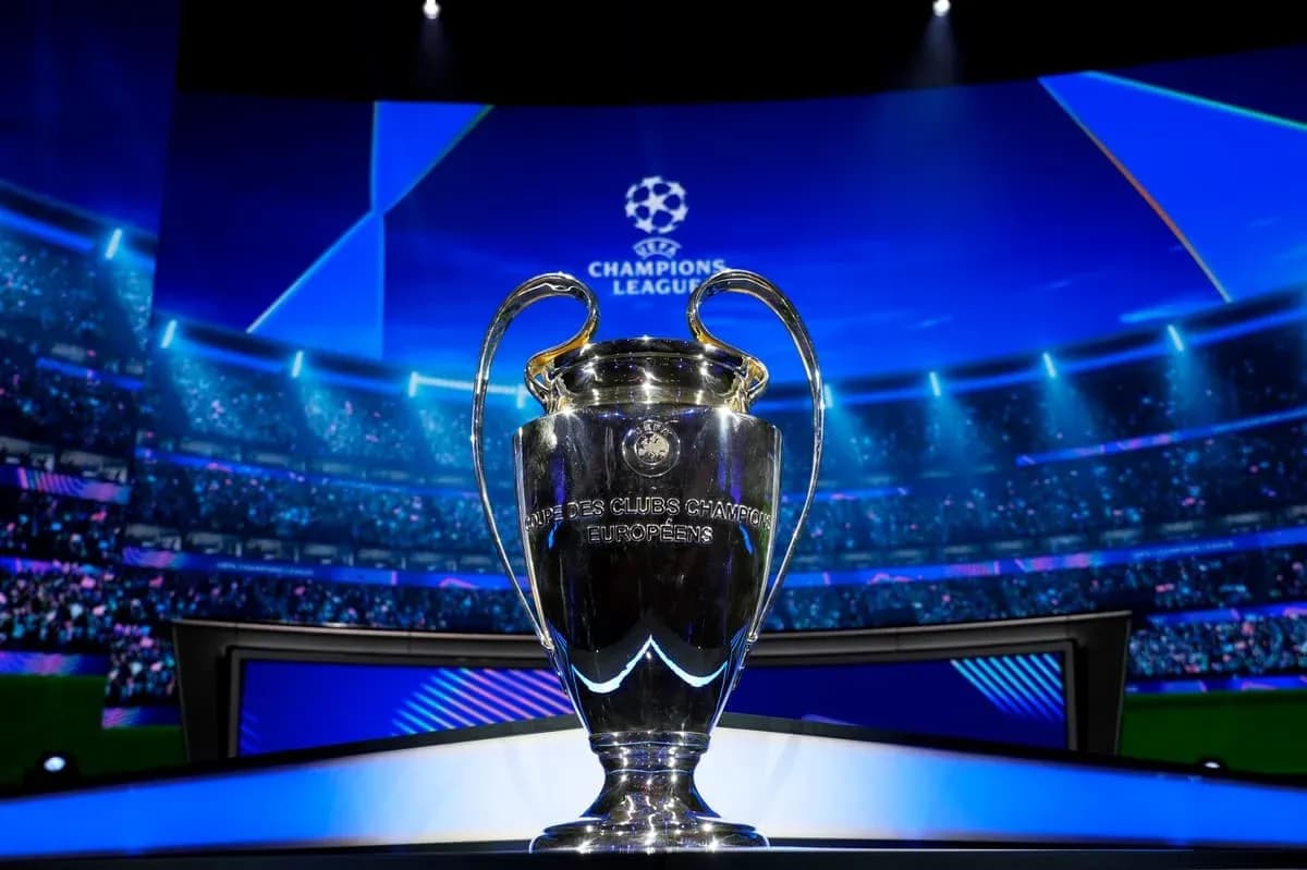 Champions League trophy displayed on stage