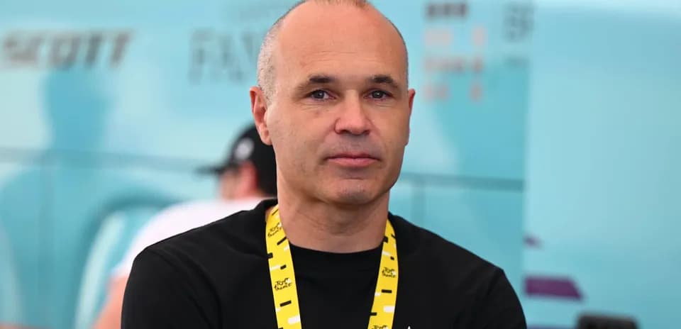Man with a lanyard standing in team area