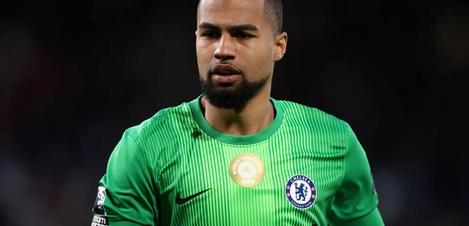 Goalkeeper in green kit during match action