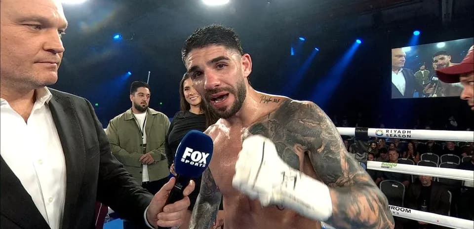 Boxer being interviewed after match in ring