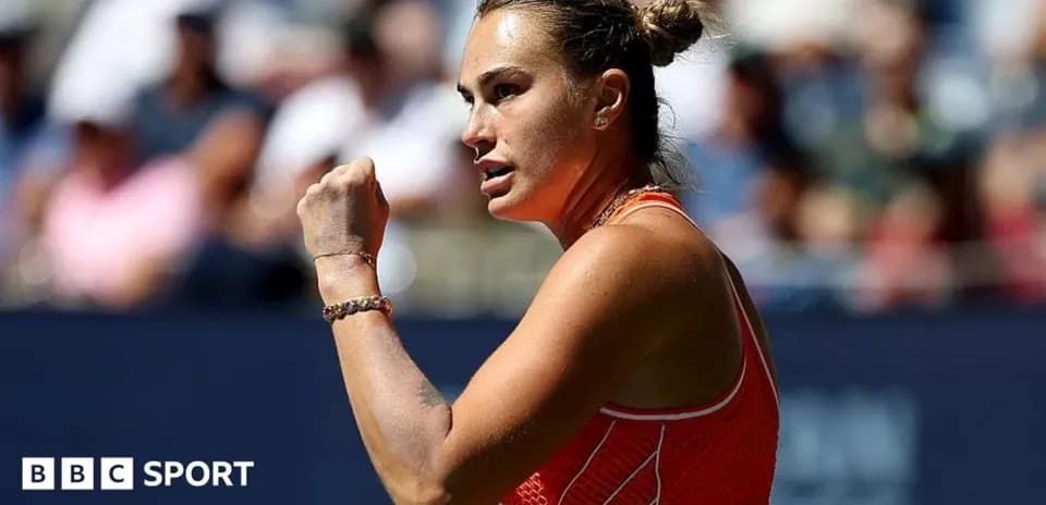 Tennis player celebrating with clenched fist on court