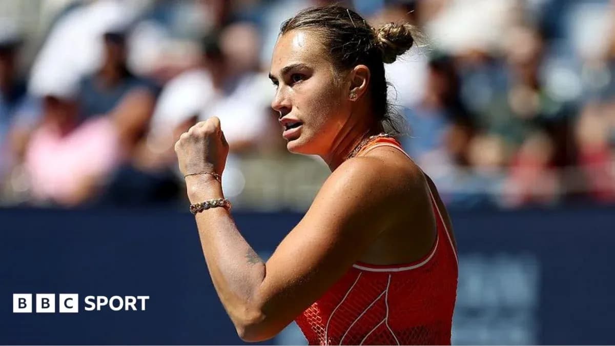 Tennis player celebrating with clenched fist on court