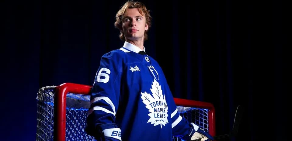 Hockey player in Toronto Maple Leafs jersey posing